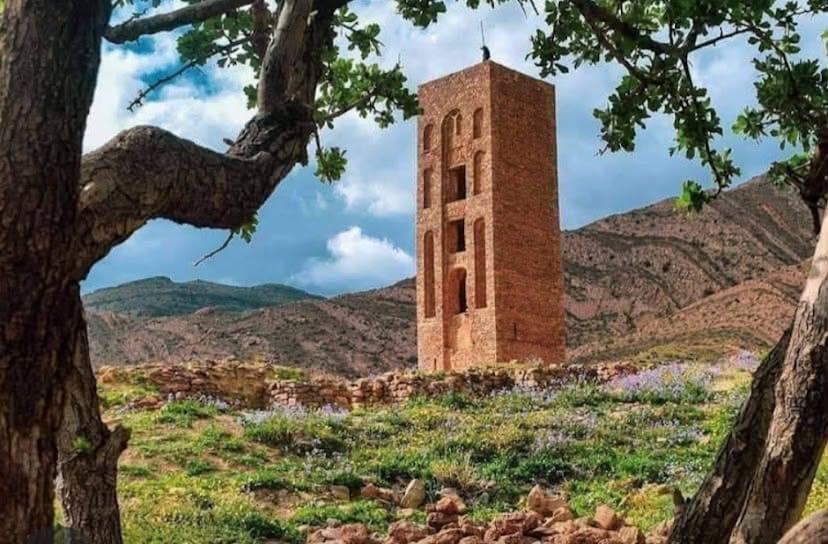 The Beni Hammad minaret framed by trees on the Hodna highland