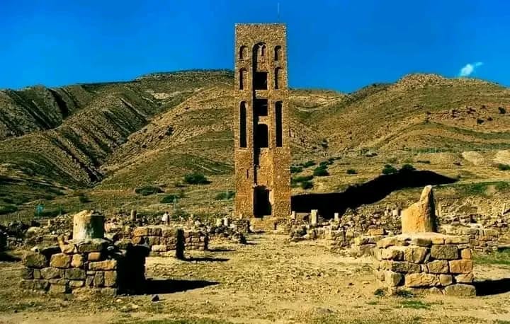 The square stone minaret of the Great Mosque standing among the ruins of Al Qal'a of Beni Hammad in the Hodna mountains