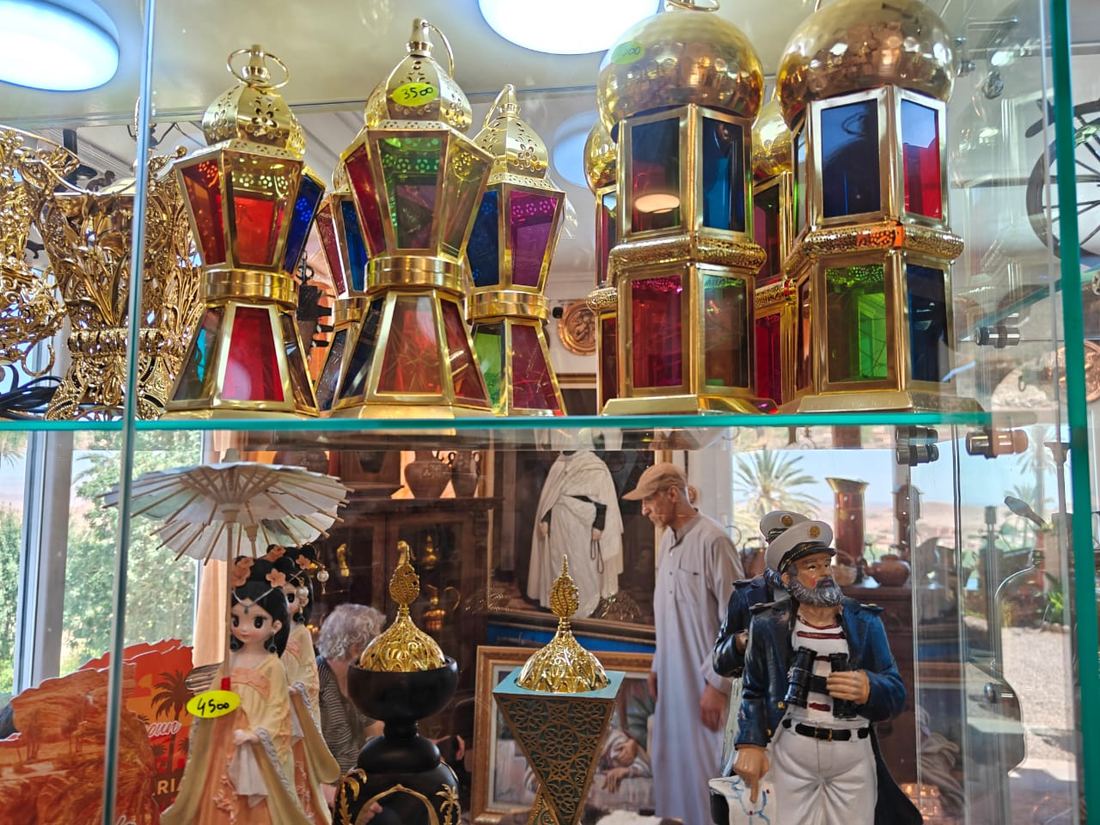 Coloured glass lanterns for sale in a shop window