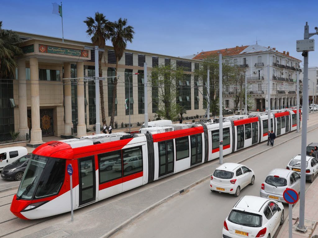 A modern tram on a tree-lined avenue in central Sétif, Algeria