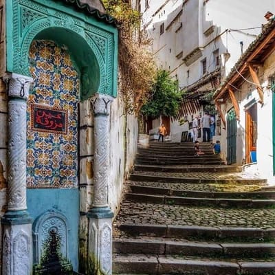 A tiled Ottoman fountain beside a stepped cobbled lane in the Casbah of Algiers