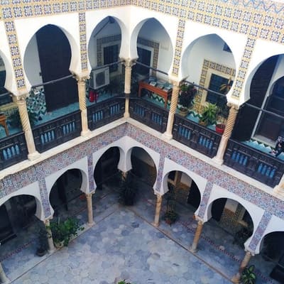Looking down into the tiled courtyard of an Ottoman palace in the Casbah from its upper gallery