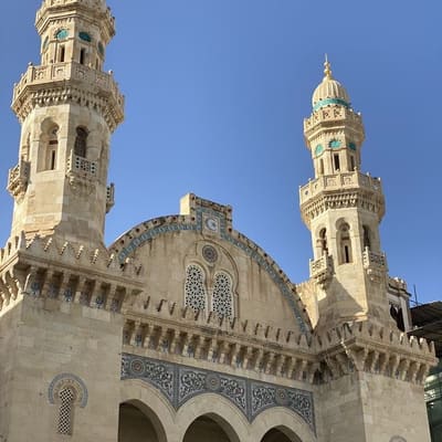 The twin minarets and carved façade of the Ketchaoua Mosque at the foot of the Casbah
