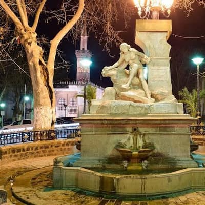 The Aïn El Fouara fountain lit at night in Sétif