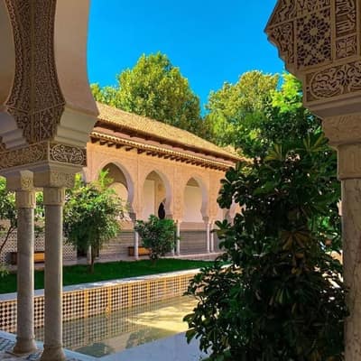 Carved arcades around the garden courtyard of the restored royal palace in Tlemcen