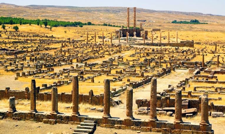 The grid-plan streets and ruins of Timgad below the Aurès mountains