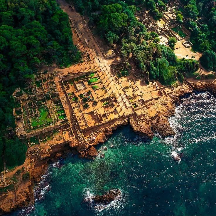 An aerial view of the ruins of Tipaza on a rocky point above the Mediterranean
