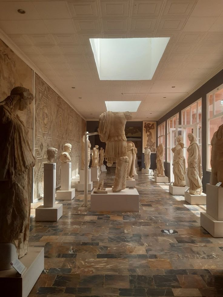 Roman marble statues lining a gallery of the Cherchell museum